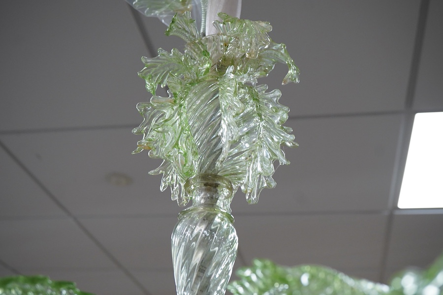 An ornate leaf and floral green glass Murano three branch chandelier, 84cm high.